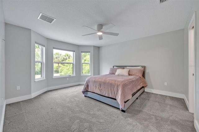 2459 Mcgregor Oaks Ln, Deland, FL 32720 - bedroom featuring carpet, baseboards, a ceiling fan, and a textured ceiling