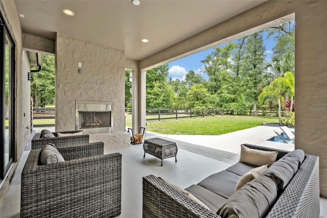 2459 Mcgregor Oaks Ln, Deland, FL 32720 - view of patio / terrace featuring an outdoor living space with a fireplace and view of wooded area