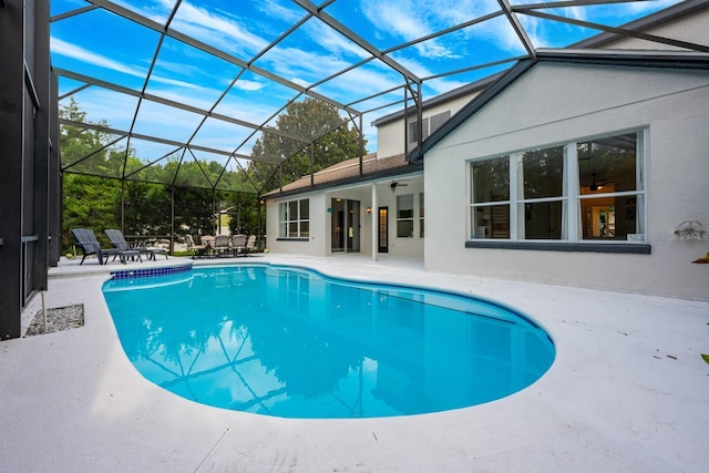 10241 Pointview Ct, Orlando, FL 32836 - outdoor pool with a patio, ceiling fan, and a lanai