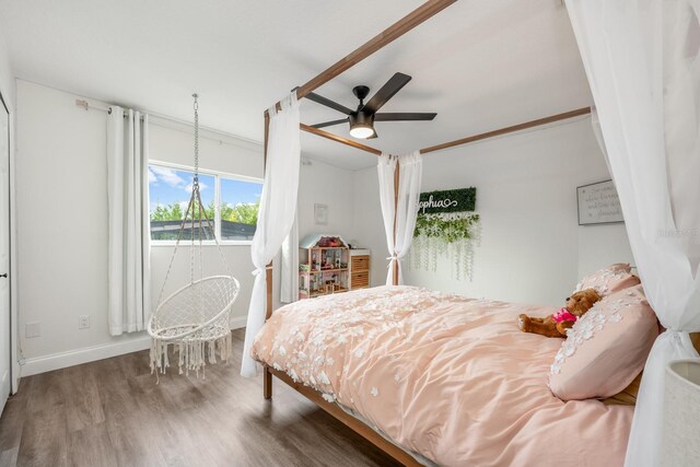 10241 Pointview Ct, Orlando, FL 32836 - bedroom featuring wood finished floors, baseboards, and a ceiling fan