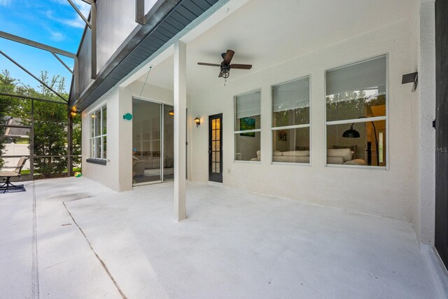 10241 Pointview Ct, Orlando, FL 32836 - view of patio / terrace with a ceiling fan and glass enclosure