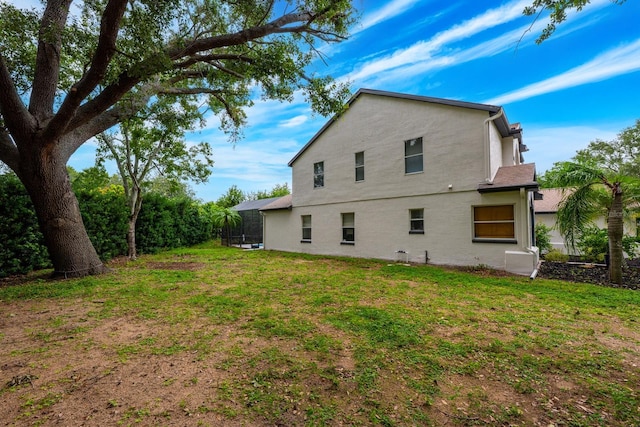 10241 Pointview Ct, Orlando, FL 32836 - rear view of property with a yard and stucco siding