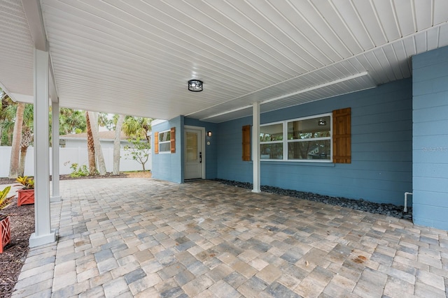 5108 Saint Albans Ave, Siesta Key, FL 34242 - view of patio / terrace featuring a carport