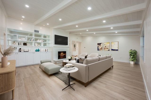 5108 Saint Albans Ave, Siesta Key, FL 34242 - living room featuring light wood finished floors, a brick fireplace, recessed lighting, baseboards, and wooden ceiling with exposed beams