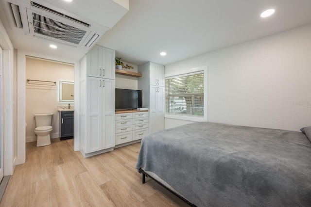 5108 Saint Albans Ave, Siesta Key, FL 34242 - bedroom with light wood-style floors, connected bathroom, and recessed lighting