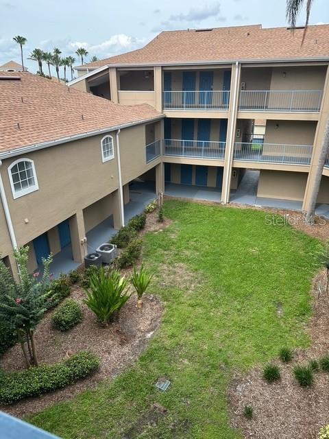 7350 Westpointe Blvd Unit 234, Orlando, FL 32835 - view of property with central AC