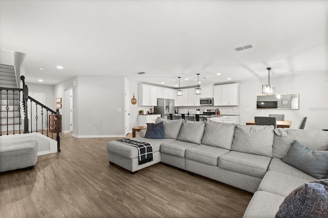 17416 Painted Leaf Way, Clermont, FL 34714 - living area with stairs, wood finished floors, recessed lighting, and baseboards