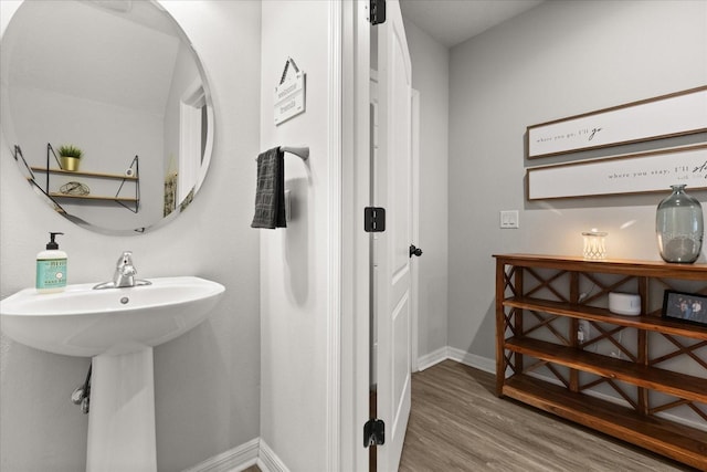 17416 Painted Leaf Way, Clermont, FL 34714 - bathroom featuring wood finished floors and baseboards
