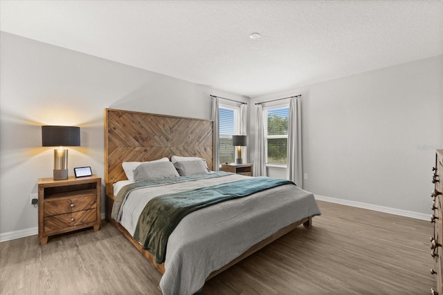 17416 Painted Leaf Way, Clermont, FL 34714 - bedroom with wood finished floors and baseboards
