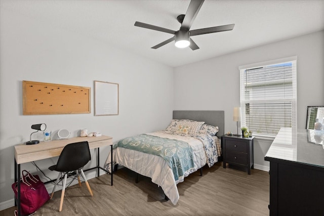 17416 Painted Leaf Way, Clermont, FL 34714 - bedroom featuring wood finished floors, baseboards, an office area, and a ceiling fan