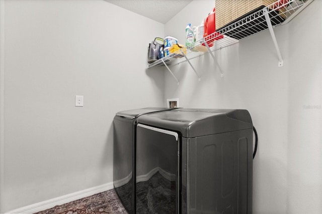 17416 Painted Leaf Way, Clermont, FL 34714 - laundry area with washer and dryer and baseboards