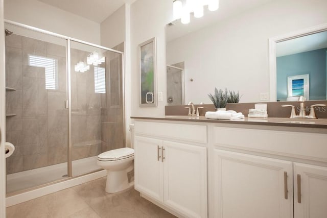 8986 Cabot Cliffs Dr, Davenport, FL 33896 - bathroom with double vanity, a shower stall, toilet, and tile patterned flooring
