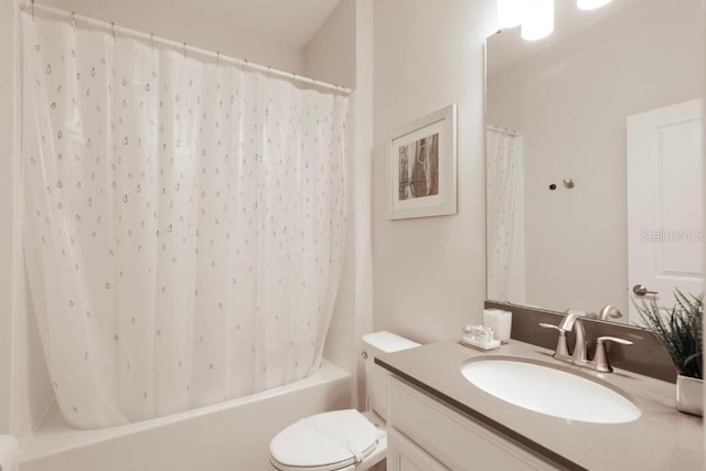 8986 Cabot Cliffs Dr, Davenport, FL 33896 - bathroom with vanity, toilet, and shower / bath combo with shower curtain