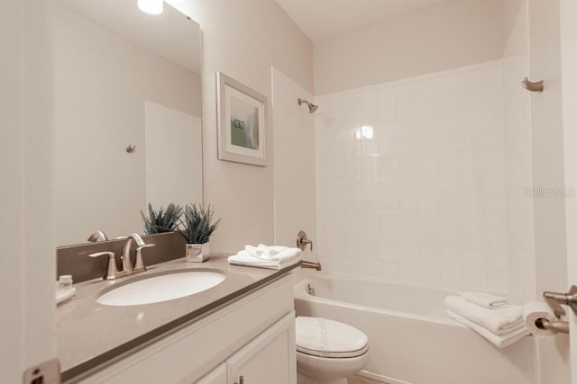 8986 Cabot Cliffs Dr, Davenport, FL 33896 - bathroom featuring vanity, toilet, and  shower combination