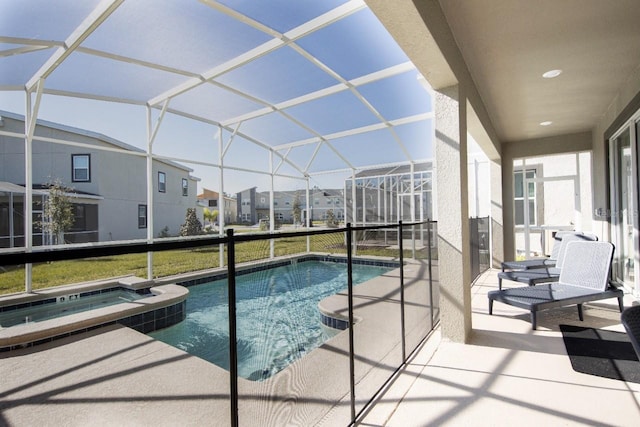 8986 Cabot Cliffs Dr, Davenport, FL 33896 - view of swimming pool with a patio, a lanai, a pool with connected hot tub, and a residential view