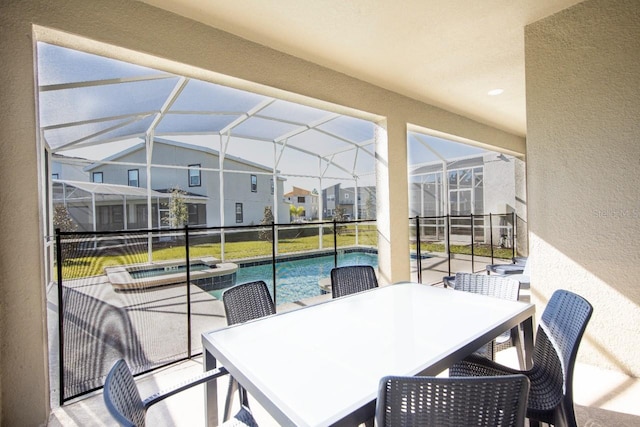 8986 Cabot Cliffs Dr, Davenport, FL 33896 - sunroom / solarium with a hot tub, lofted ceiling, and outdoor dining area