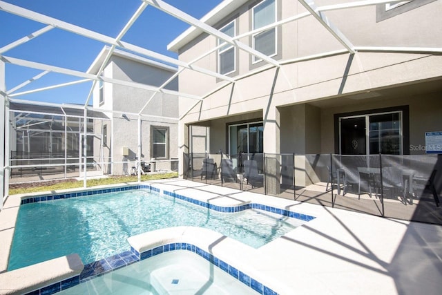 8986 Cabot Cliffs Dr, Davenport, FL 33896 - view of swimming pool featuring a patio area, a pool with connected hot tub, and a lanai