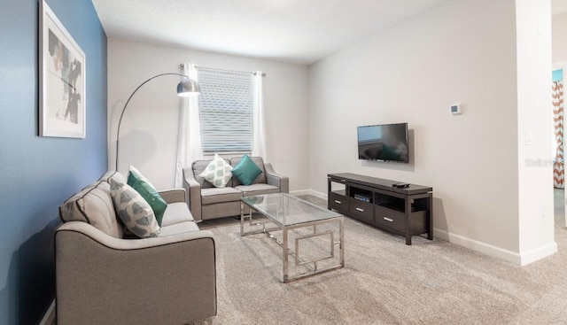 8986 Cabot Cliffs Dr, Davenport, FL 33896 - carpeted living room with baseboards