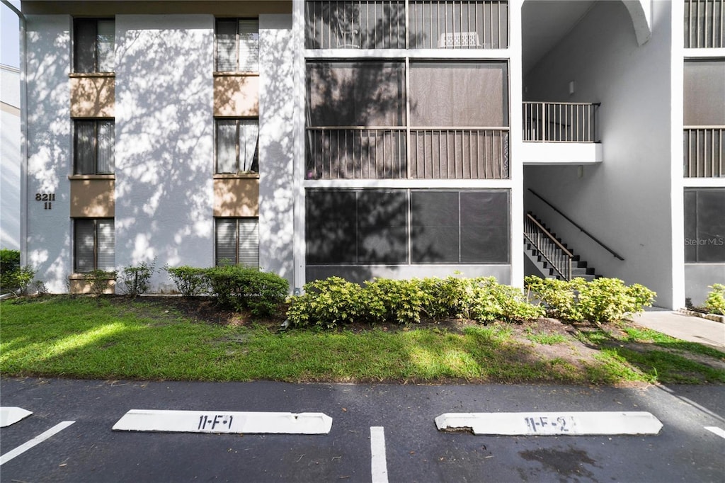8211 Sun Spring Cir Unit 11, Orlando, FL 32825 - view of property with uncovered parking