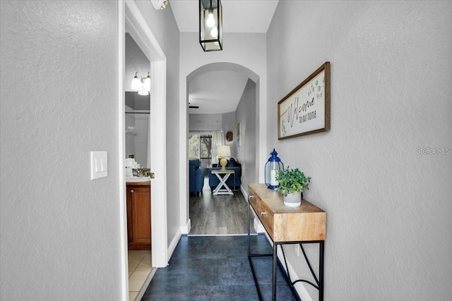 3214 Calabria Ave, Davenport, FL 33897 - hallway with arched walkways and a textured wall