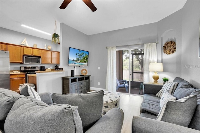 3214 Calabria Ave, Davenport, FL 33897 - living area featuring ceiling fan, wood finished floors, and baseboards