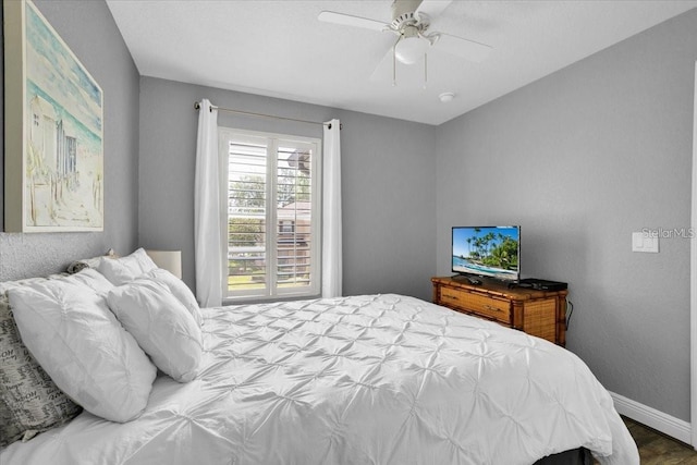 3214 Calabria Ave, Davenport, FL 33897 - bedroom featuring baseboards and a ceiling fan