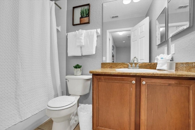 3214 Calabria Ave, Davenport, FL 33897 - full bath featuring toilet, vanity, a shower with curtain, a textured wall, and tile patterned flooring