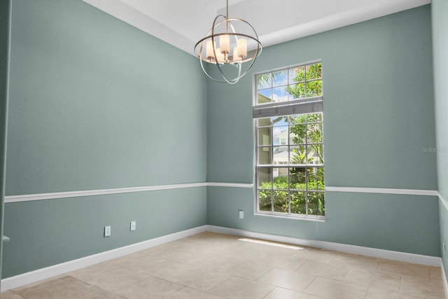 3307 Kentshire Blvd, Ocoee, FL 34761 - empty room with a chandelier, baseboards, and tile patterned floors