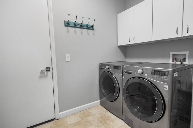 3307 Kentshire Blvd, Ocoee, FL 34761 - laundry area with cabinet space, washer and dryer, baseboards, and light tile patterned flooring