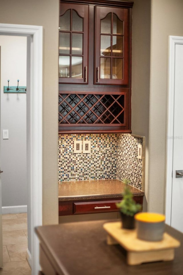 3307 Kentshire Blvd, Ocoee, FL 34761 - bar featuring decorative backsplash and light tile patterned floors
