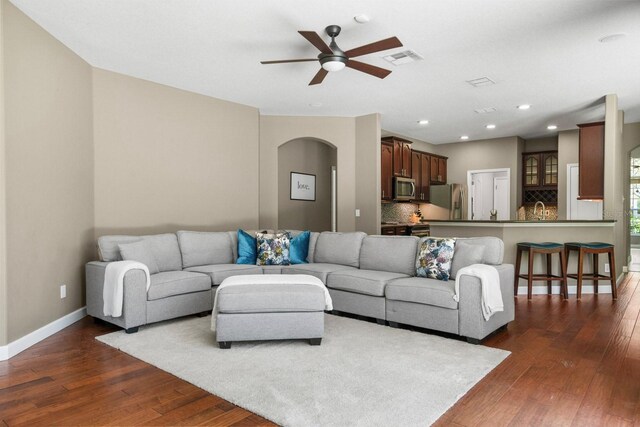 3307 Kentshire Blvd, Ocoee, FL 34761 - living area with ceiling fan, dark wood finished floors, baseboards, arched walkways, and recessed lighting