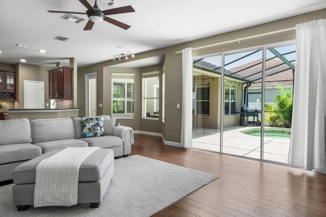 3307 Kentshire Blvd, Ocoee, FL 34761 - living room with a ceiling fan, wood finished floors, healthy amount of natural light, and baseboards