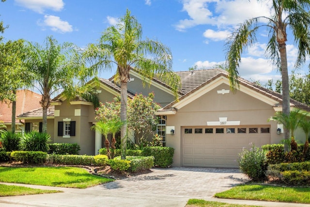 3307 Kentshire Blvd, Ocoee, FL 34761 - view of front of property featuring stucco siding, driveway, and a garage