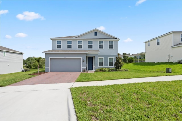 2168 Aibonito Cir, Clermont, FL 34711 - traditional-style house featuring decorative driveway, a front lawn, a garage, roof with shingles, and stucco siding