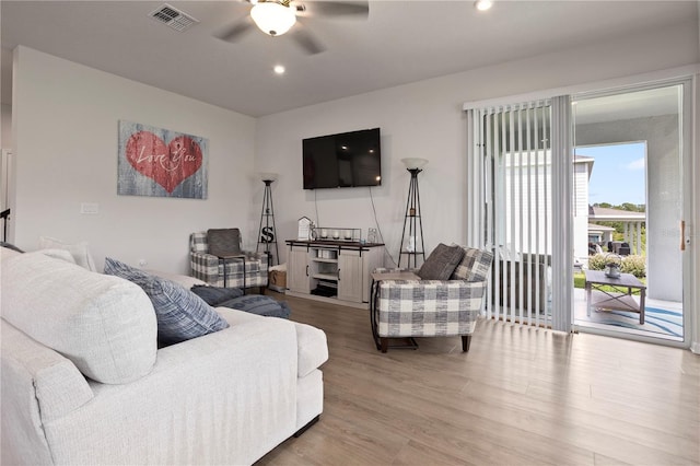 2168 Aibonito Cir, Clermont, FL 34711 - living room featuring a ceiling fan, wood finished floors, and recessed lighting
