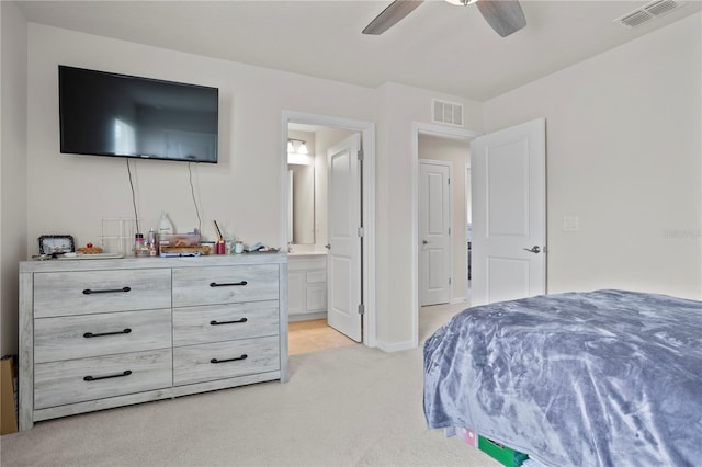 2168 Aibonito Cir, Clermont, FL 34711 - bedroom featuring light carpet, ensuite bathroom, and a ceiling fan