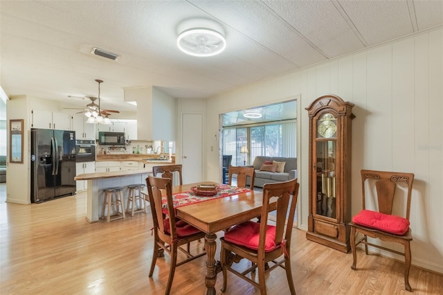 142 Florence Blvd, Debary, FL 32713 - dining room with light wood finished floors and ceiling fan