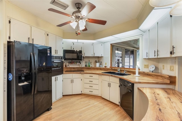 142 Florence Blvd, Debary, FL 32713 - kitchen featuring black appliances, butcher block counters, a sink, a ceiling fan, and light wood-type flooring