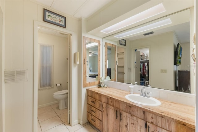 142 Florence Blvd, Debary, FL 32713 - bathroom featuring tile patterned flooring, toilet, and vanity