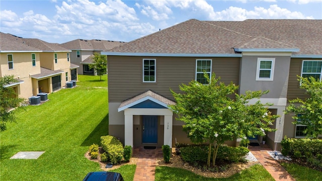 130 Claire Ln, Davenport, FL 33837 - view of front of house featuring a front yard and a shingled roof