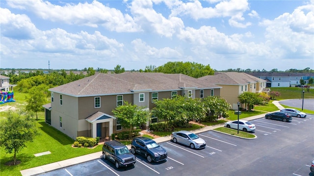 130 Claire Ln, Davenport, FL 33837 - uncovered parking lot featuring a residential view