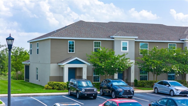 130 Claire Ln, Davenport, FL 33837 - view of building exterior featuring uncovered parking