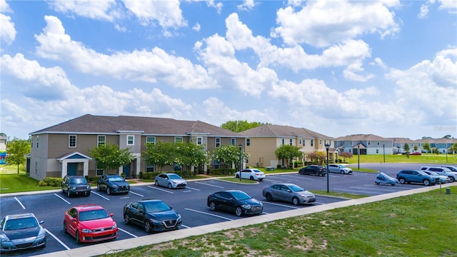 130 Claire Ln, Davenport, FL 33837 - uncovered parking lot with a residential view