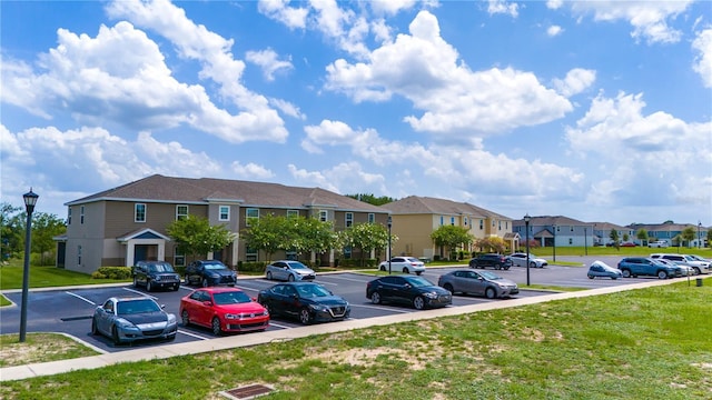 130 Claire Ln, Davenport, FL 33837 - uncovered parking lot with a residential view