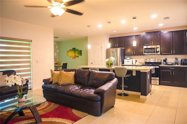 130 Claire Ln, Davenport, FL 33837 - living area with light tile patterned floors, a ceiling fan, and recessed lighting