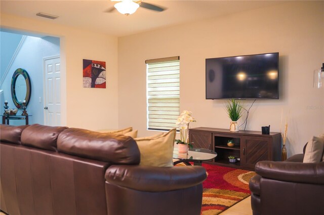 130 Claire Ln, Davenport, FL 33837 - living area featuring ceiling fan and tile patterned floors