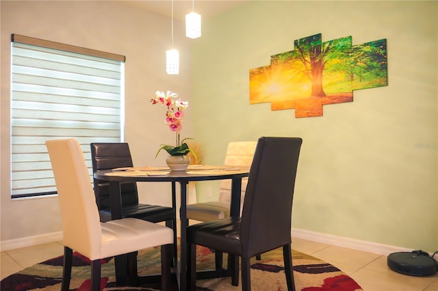 130 Claire Ln, Davenport, FL 33837 - tiled dining room featuring baseboards