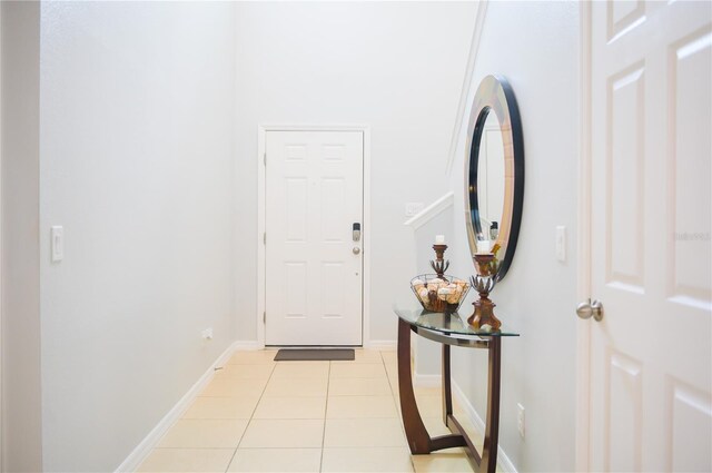 130 Claire Ln, Davenport, FL 33837 - entrance foyer featuring light tile patterned floors and baseboards