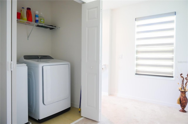 130 Claire Ln, Davenport, FL 33837 - laundry area featuring washer and clothes dryer and light colored carpet