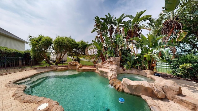10809 Arrowtree Blvd, Clermont, FL 34715 - view of swimming pool with an in-ground hot tub and a fenced backyard
